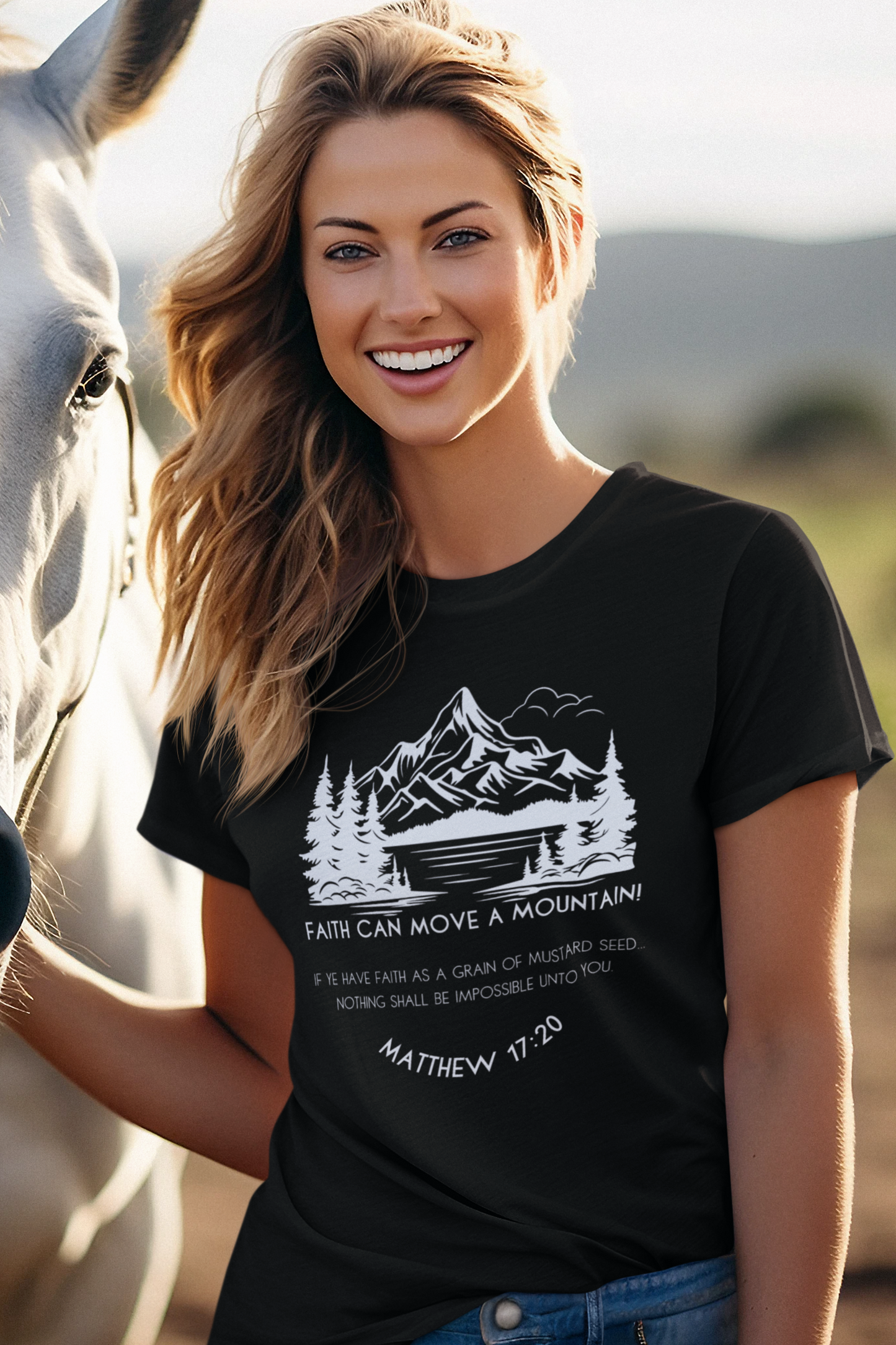 Christian T-Shirt for Ladies with "Faith can move a mountain. Matthew 17:20" print design. T-shirt is crew neck, short-sleeved and black.