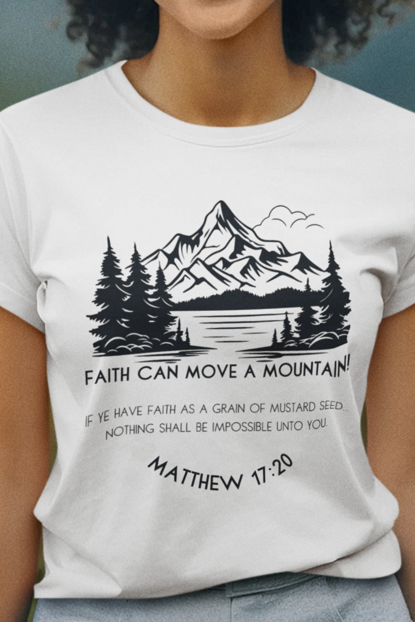 White Christian T-Shirt for Ladies with "Faith can move a mountain. Matthew 17:20" print design. T-shirt is crew neck, short-sleeved and a classic fit.