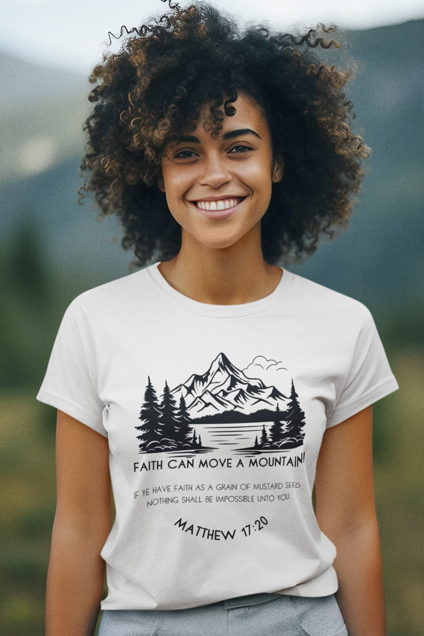 Christian T-Shirt for Ladies with "Faith can move a mountain. Matthew 17:20" print design. T-shirt is white, crew neck, short-sleeved and a classic fit.