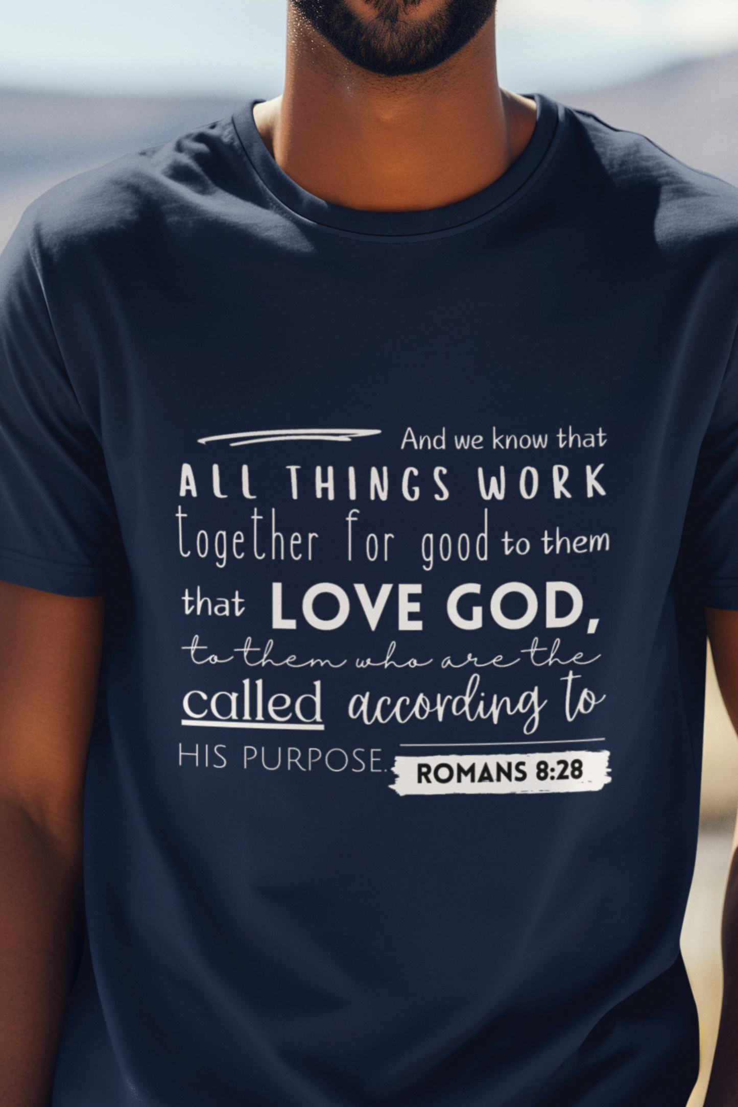 Navy Blue Christian T-Shirt with Romans 8:28 design. Crew neck, short-sleeved, classic fit