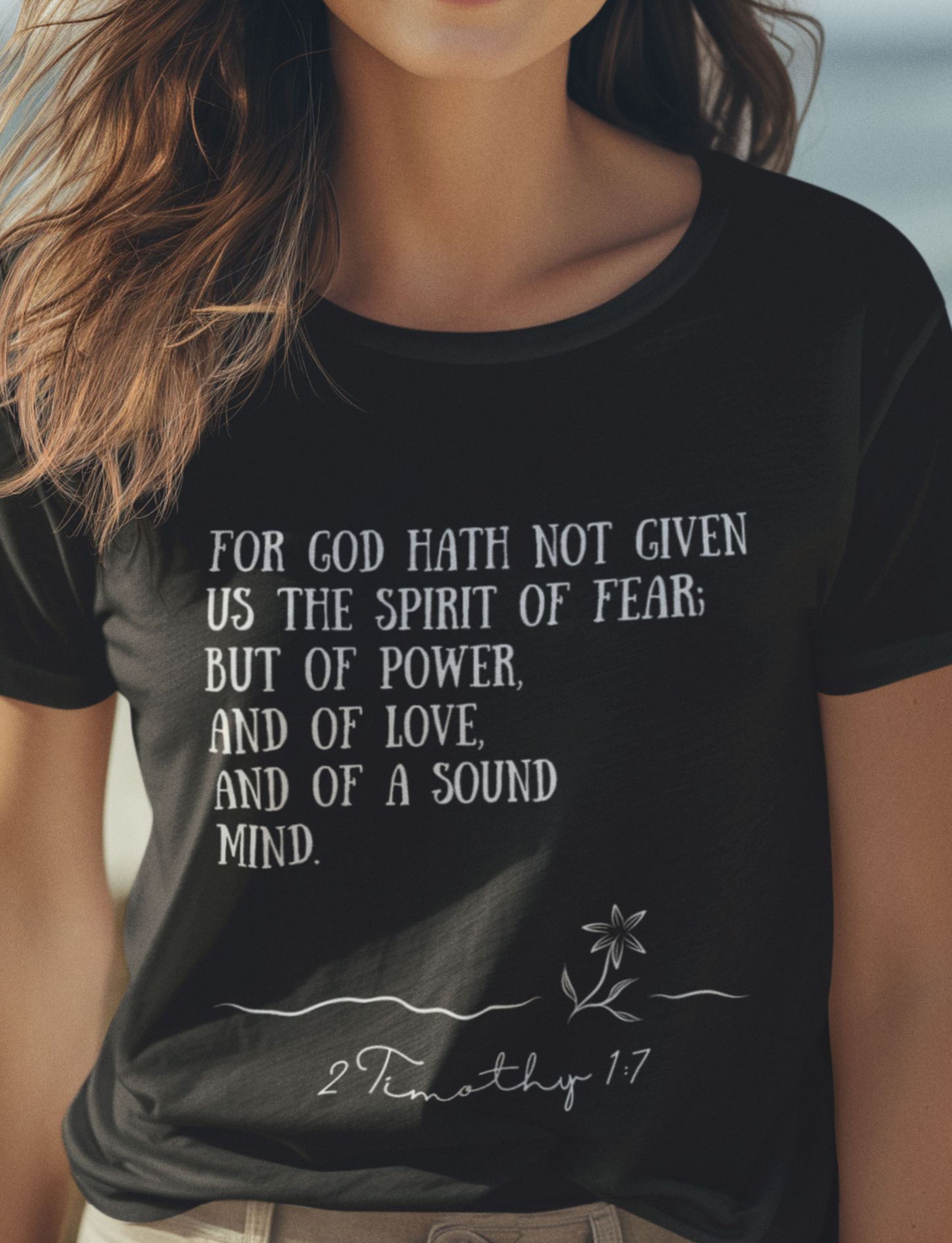 Black Ladies Christian T-Shirt with 2 Timothy 1:7 print design. Crew neck, short-sleeved, classic fit.