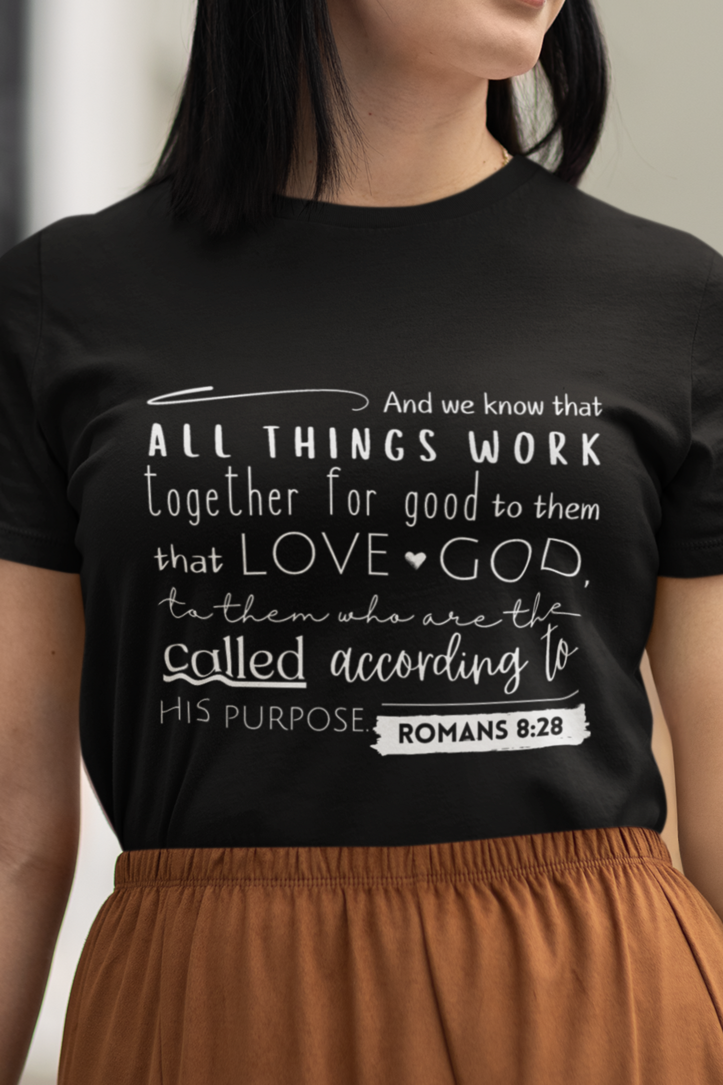 Black Christian T-Shirt with Romans 8:28 KJV print design. Crew neck, Short-sleeved, classic fit