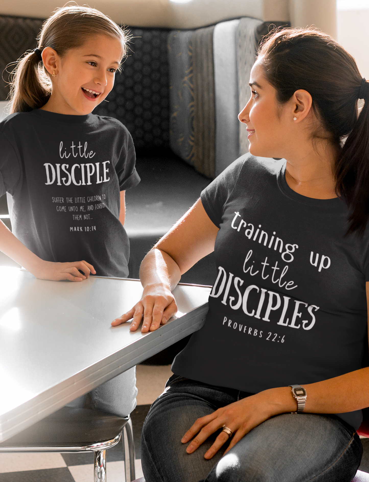 Kid's Christian Mother's Day Black T-shirt with "Little Disciple" print design. Crew neck, short-sleeved, unisex, classic retail fit