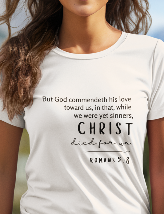 White Christian Ladies T-Shirt with Romans 5:8 Bible verse print design. Crew neck, short-sleeved, unisex