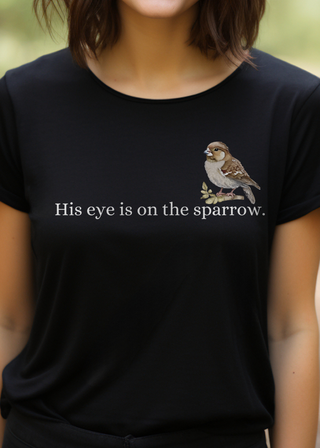 Black Christian T-Shirt with "His Eye is on the Sparrow" print design. Crew neck, short-sleeved, classic fit, soft fabric