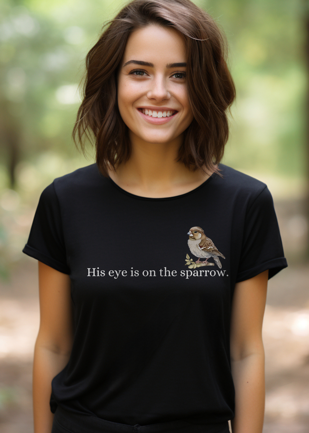 Black Christian T-Shirt with "His Eye is on the Sparrow" print design. Crew neck, short-sleeved, classic fit, soft fabric