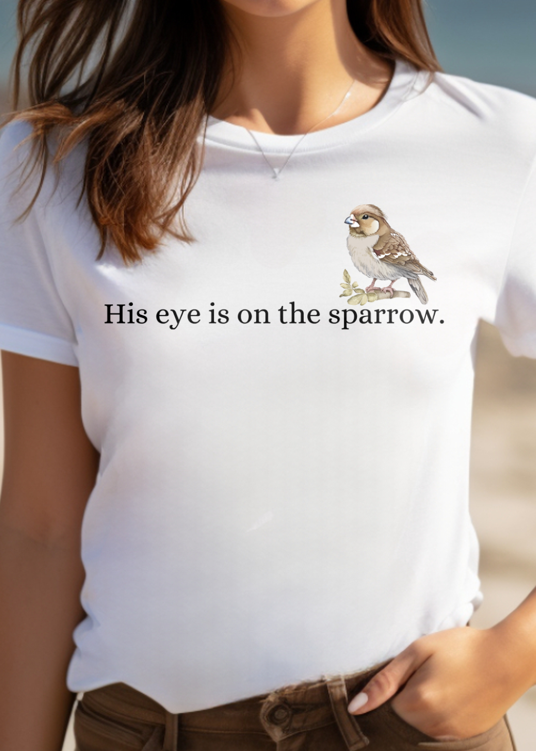 White Christian T-Shirt with "His Eye is on the Sparrow" print design. Crew neck, short-sleeved, classic fit, soft fabric