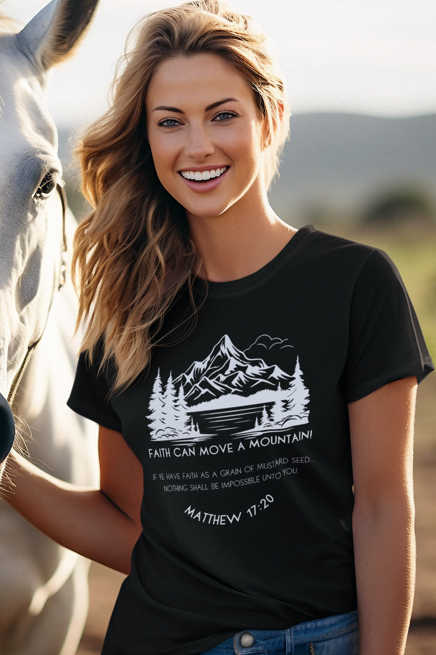 Christian T-Shirt for Ladies with "Faith can move a mountain. Matthew 17:20" print design.  T-shirt is crew neck, short-sleeved and black.