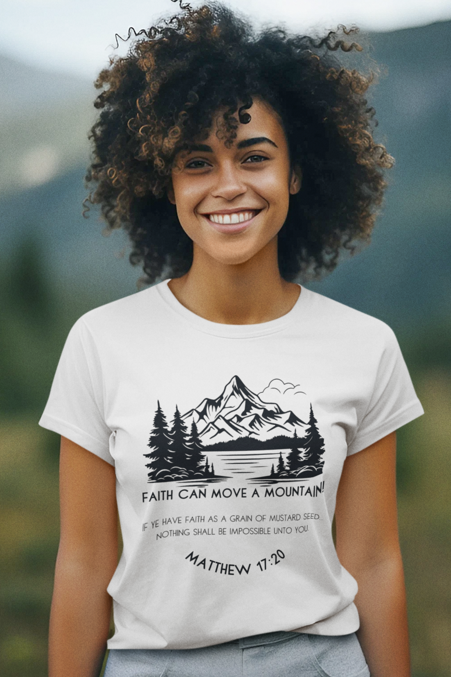 Christian T-Shirt for Ladies with "Faith can move a mountain. Matthew 17:20" print design.  T-shirt is white, crew neck, short-sleeved and a classic fit.