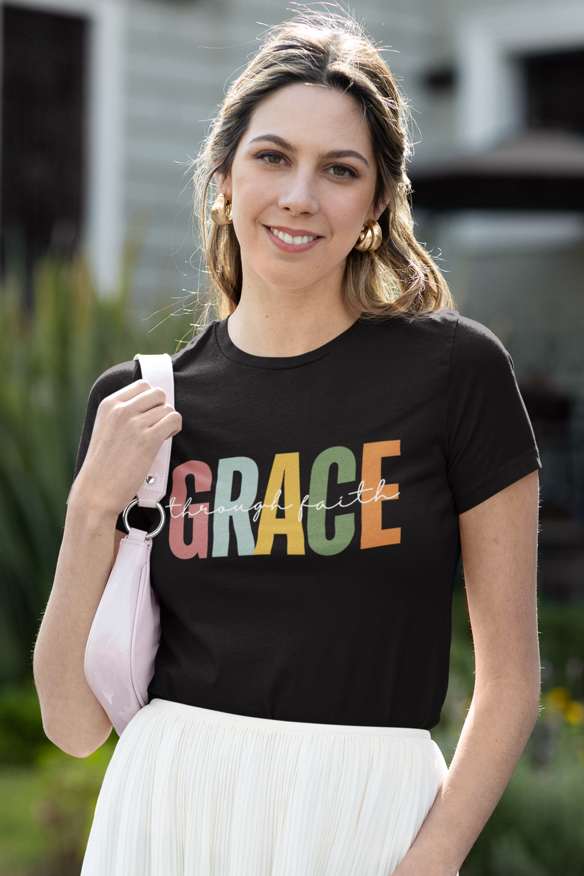 Ladies Christian T-shirt with "Grace Through Faith" print design, short-sleeved black shirt.