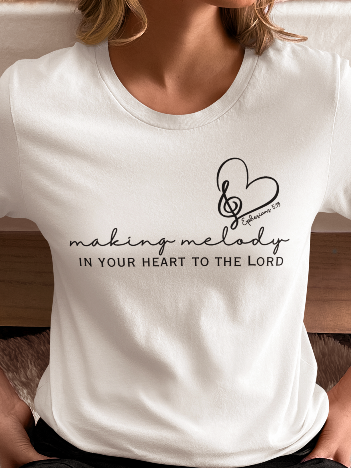 White Christian Tshirt for Ladies with "Making Melody In your Hear to the Lord" print design. Crewneck, short-sleeved, classic fit.