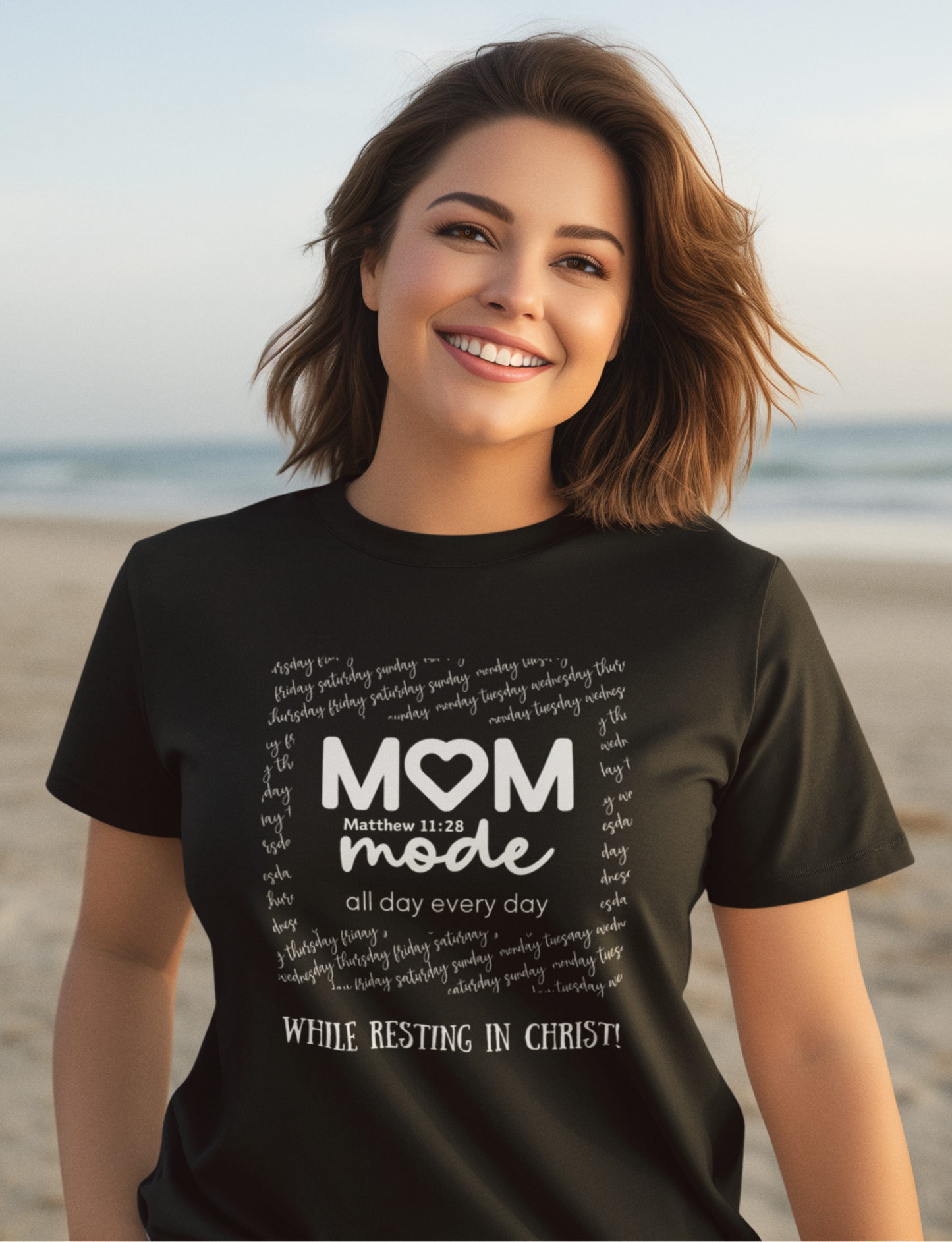 Black Mother's Day Christian T-Shirt with "Mom Mode, All Day Every Day While Resting in Christ" print design. Crew neck, short-sleeved, classic fit.