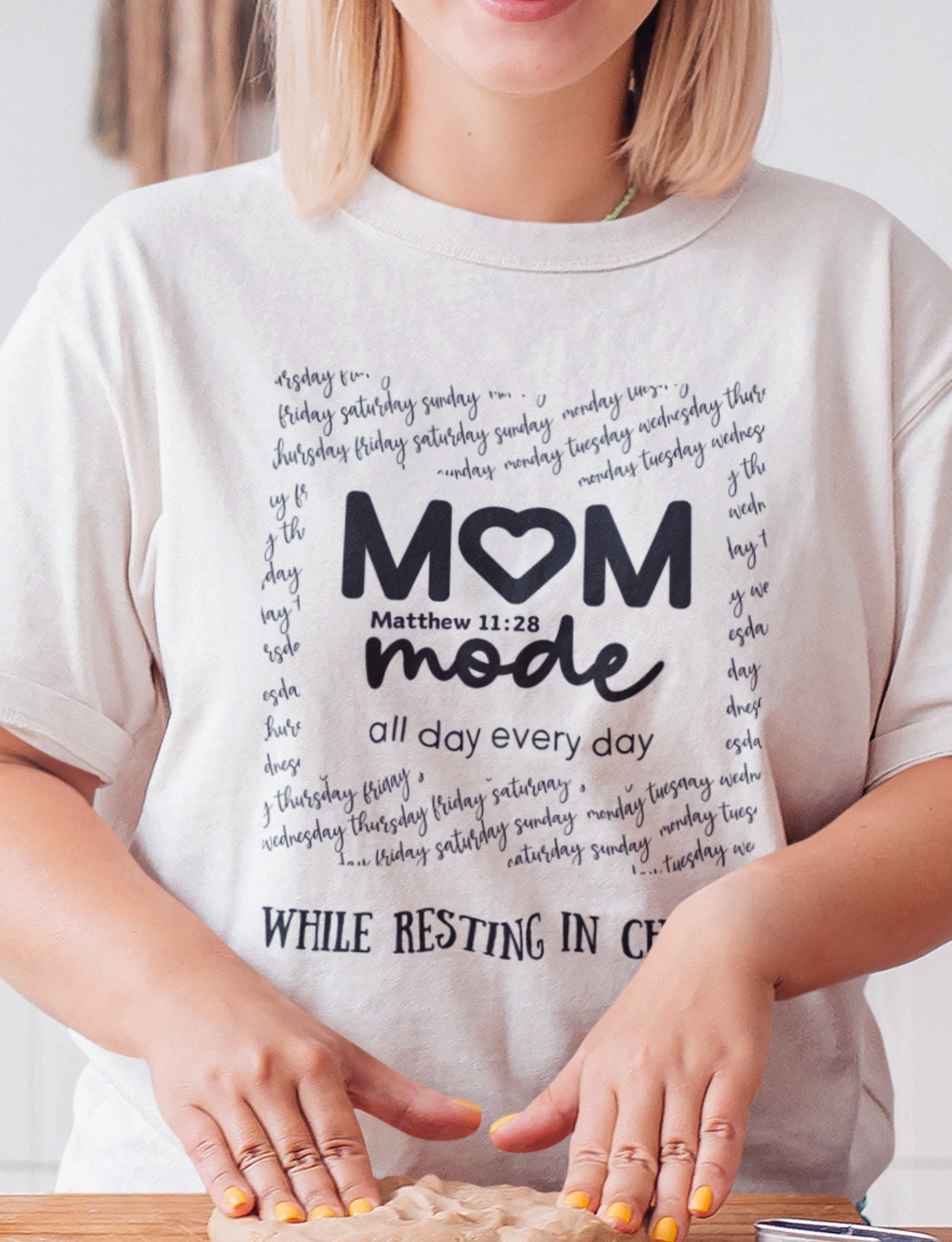 White Mother's Day Christian T-Shirt with "Mom Mode, All Day Every Day While Resting in Christ" print design. Crew neck, short-sleeved, classic fit.