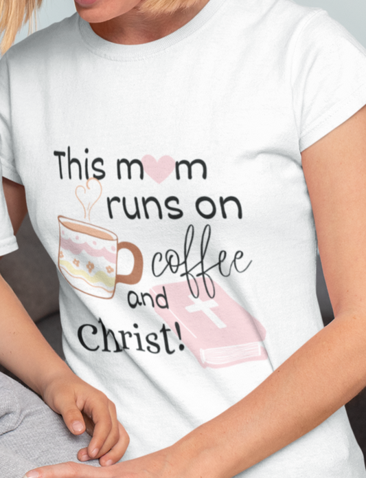 White Mother's Day Christian T-Shirt with "This mom runs of coffee and Christ" print design. Crew neck, short-sleeved, soft fabric.