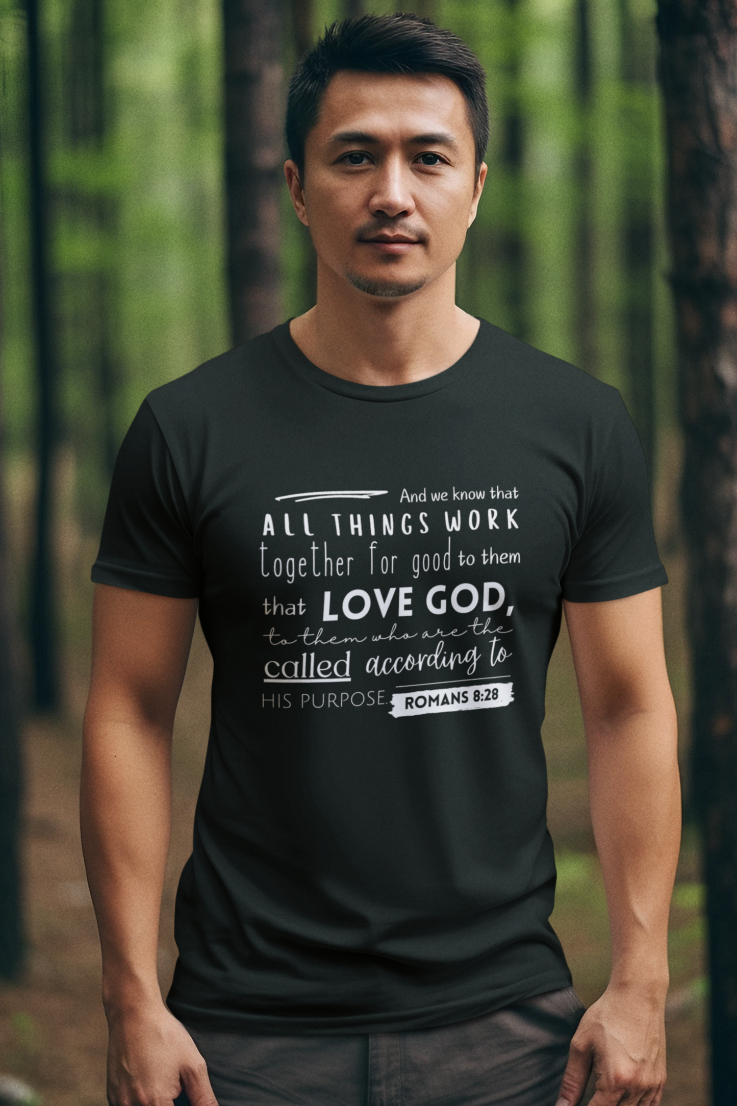 Black Christian T-Shirt with Romans 8:28 design. Crew neck, short-sleeved, classic fit