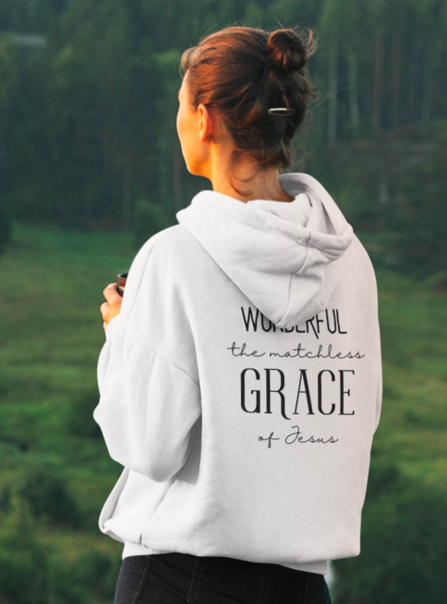 White Christian pullover hoodie with "Wonderful the Matchless Grace of Jesus" print design at the back. With large front pouch pocket.