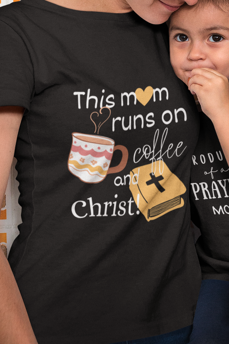 Black Mother's Day Christian T-Shirt with "This mom runs of coffee and Christ" print design. Crew neck, short-sleeved, soft fabric.