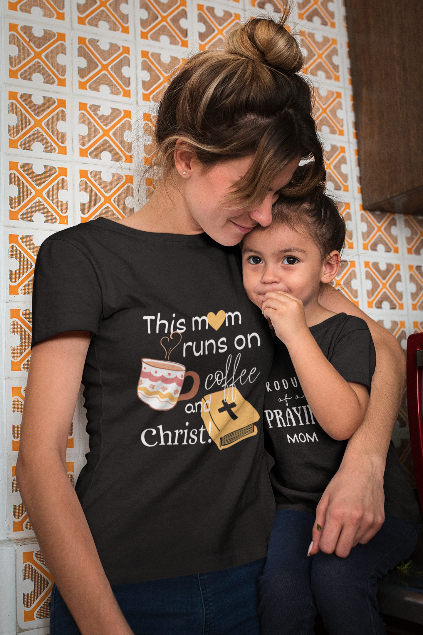 Mother's Day Christian Black T-Shirt with "This mom runs of coffee and Christ" print design. Crew neck, short-sleeved, soft fabric.